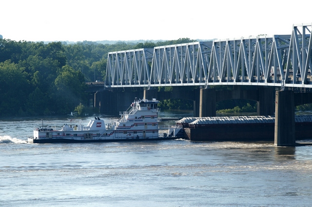 Towboat Mike Weisend fights the current of the Mississippi River on May 27, 2011 with inches to spare. (note flagpoles and masts have been removed)